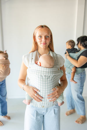 Monroe x Coco Gingham Cotton Baby Carrier for infants 7-35 lbs, shown from angle 7. Stylish and comfortable support.