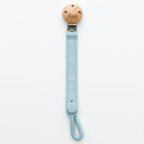 Nash Everything Clip in Blossom design, a stylish pacifier clip for babies, shown from angle 7.