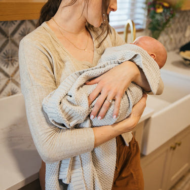 Soft knitted Julep swaddle blanket for babies, perfect for cozy comfort and warmth.