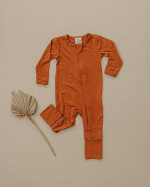 Solid Bamboo Zippy Pajamas in various colors, angle view 5, perfect for baby comfort and style.