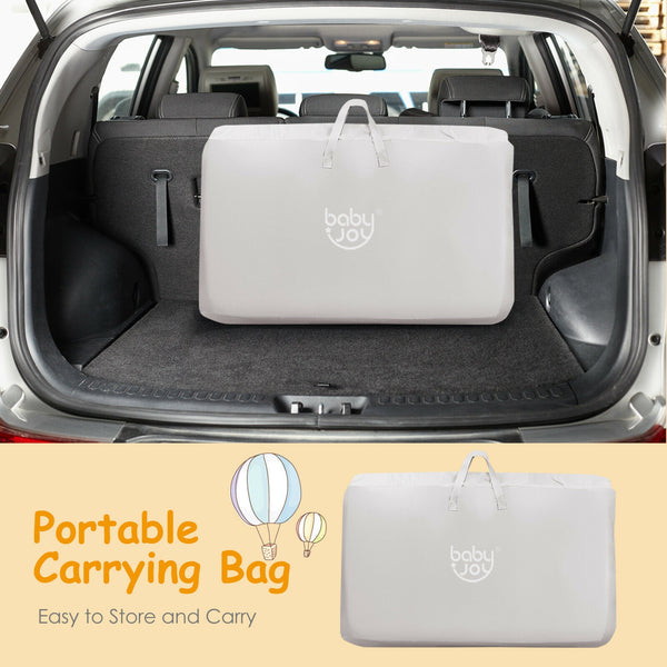 Portable baby bed side sleeper bassinet crib with carrying bag, angled view for travel convenience.