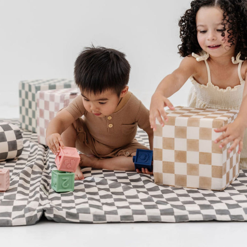 Checker Toffee Play Cube for babies, featuring engaging textures and colors for sensory play and development.