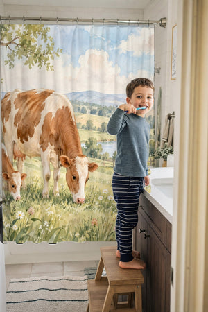 Child brushing teeth in a family bathroom with the Cow and Calf Farm shower curtain