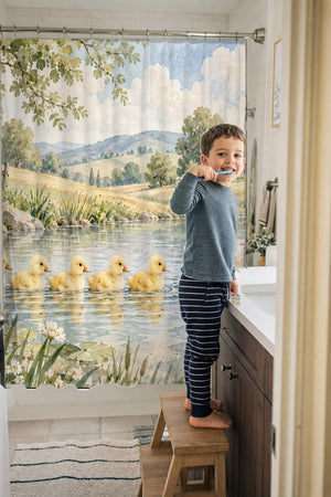 Child brushing teeth in a family bathroom with the Ducklings Pond Farm shower curtain