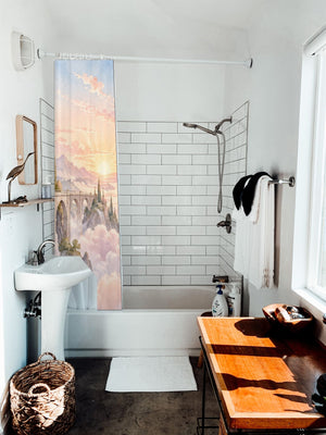 Cloud Towers Fairy Tale shower curtain hanging on the rod over a white bathtub