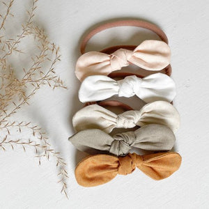Knotted hair bow in earthy tones, perfect accessory for babies, featured at an angle for a stylish view.