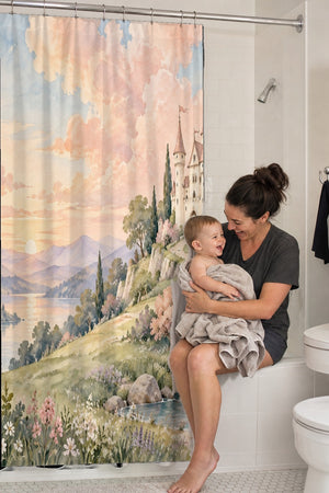 Mom holding her baby on the tub edge next to the Hilltop Castle Fairy Tale shower curtain