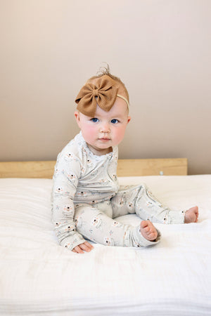Polar Bear Zippy Romper for babies, cozy and cute, shown from angle 5. Perfect for playtime and comfort.