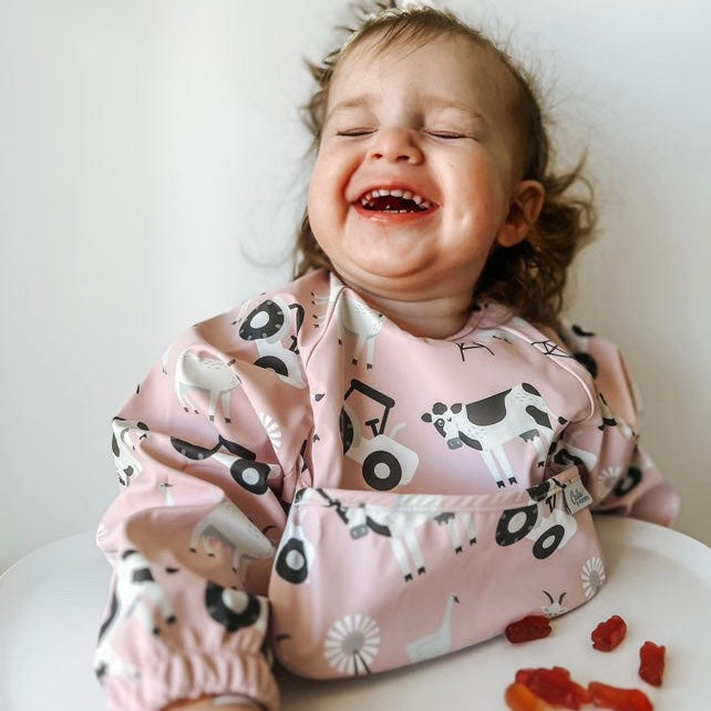 Grayson Long Sleeve Bib featuring a charming farm design for mess-free mealtime fun.