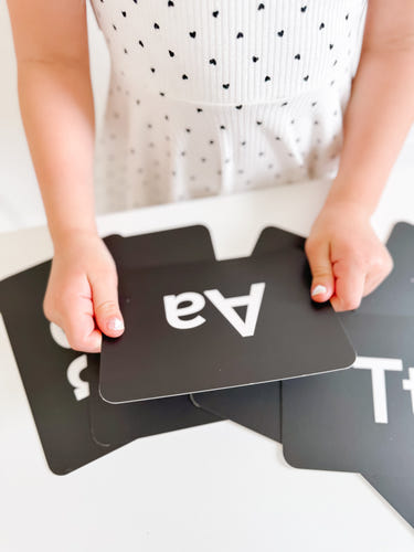 Black and white letter flashcards for early learning and sensory play, perfect for babies and toddlers.