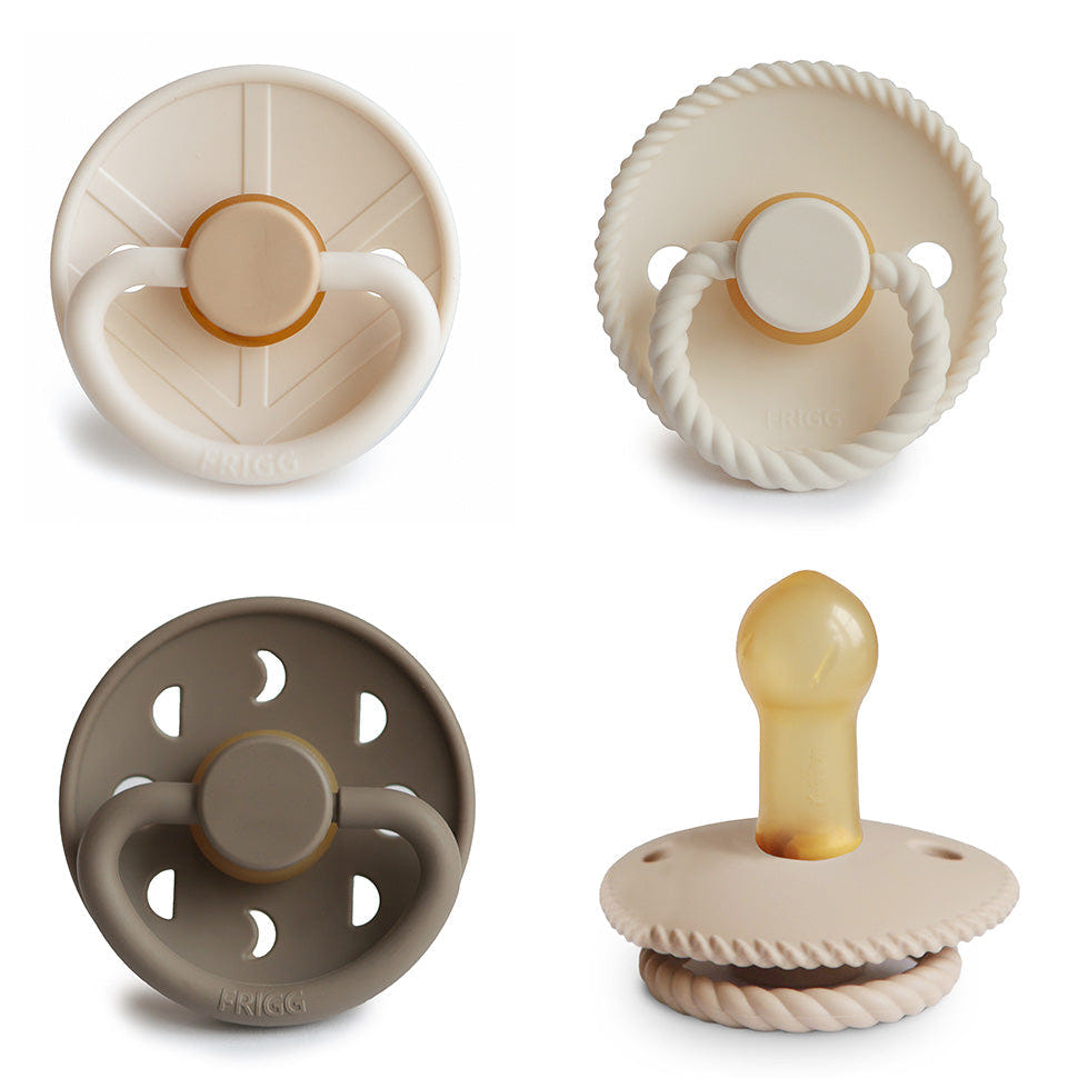FRIGG Natural Rubber Pacifier 4-Pack in assorted colors for babies, promoting comfort and soothing.