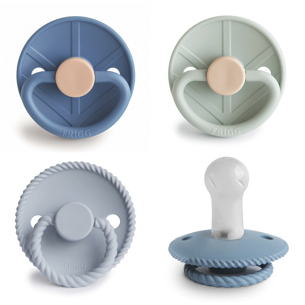 FRIGG Silicone Pacifier 4-Pack in assorted colors, perfect for soothing babies comfortably and safely.