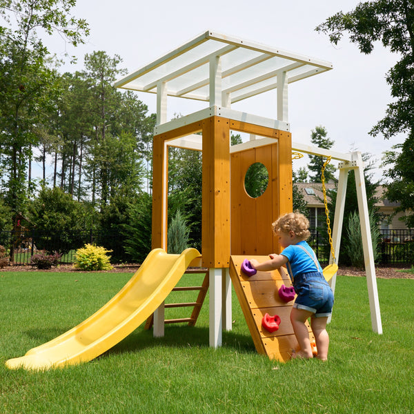 Compact wooden toddler swing set for outdoor play, perfect for babies and kids in a forest setting.