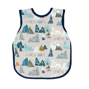 "Adventure Awaits Bapron for babies, angle view showcasing fun design and practical features for mealtime."