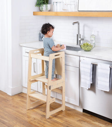 4-in-1 Kitchen Tower & Desk for babies, perfect for indoor play and learning activities.