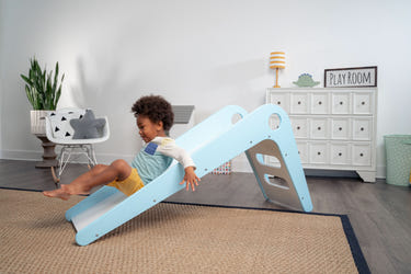 Modern toddler slide in soft colors, perfect for indoor playtime and safe fun for little ones.