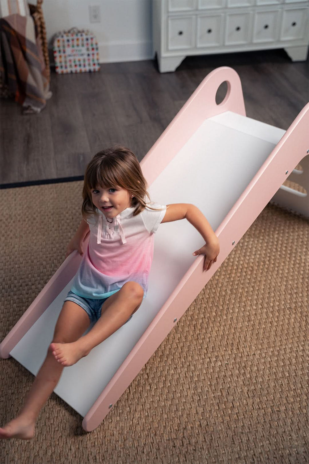 Modern toddler slide in soft colors, perfect for indoor playtime and safe fun for little ones.