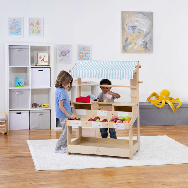 Cypress Wooden Market Stand for kids' pretend play, featuring storage, viewed from angle 4.