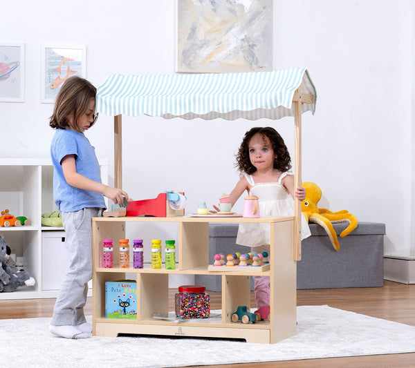 Holly Wooden Market Stand for kids' pretend play, featuring a colorful display shelf at angle 11.