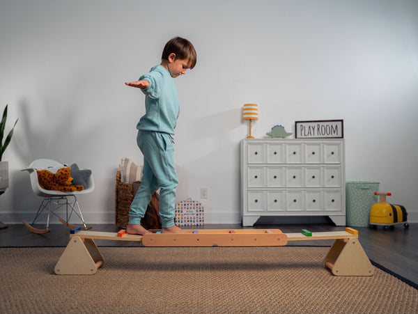 Willow Rainbow Seesaw and Balance Beam for indoor play, showcasing vibrant colors and sturdy design from angle 2.