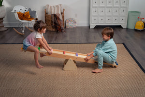 Willow Rainbow Seesaw and Balance Beam for indoor play, promoting balance and fun for toddlers.