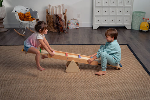 Willow Rainbow Seesaw and Balance Beam for indoor play, promoting balance and fun for toddlers.