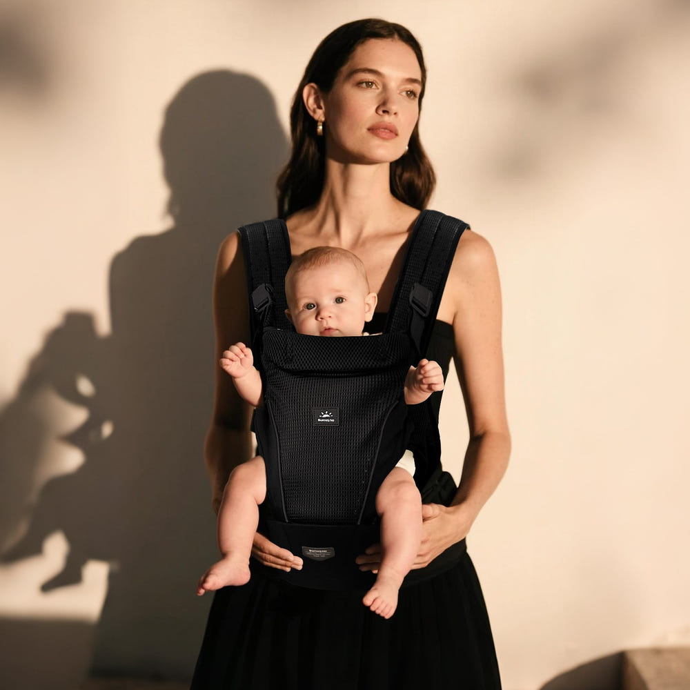 All-in-One Baby Carrier for comfortable and safe babywearing, perfect for parents on the go.