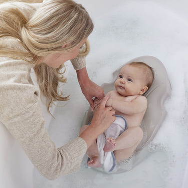 Shnuggle Newborn Baby Bath Support - Ergonomic, non-slip, quick-dry for babies 0-6 months. Safe and comfortable bathing.