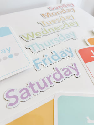 Colorful calendar flashcards and magnets for early learning, featuring days, months, and seasons for sensory play.