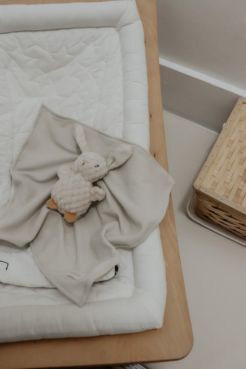 Coco Ivory Waffle Knit Blanket for babies, soft and cozy swaddle in stylish design, perfect for comfort and warmth.