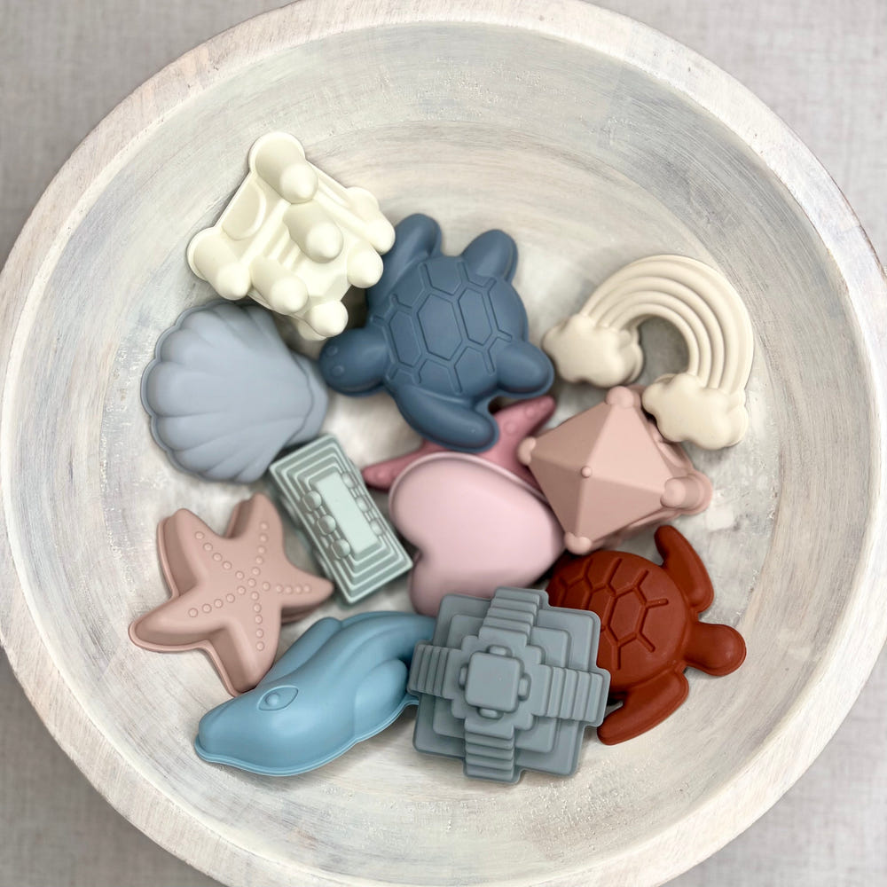 Bodhi Sand Mold Set for kids - colorful beach toys for creative sand play and fun at the beach.