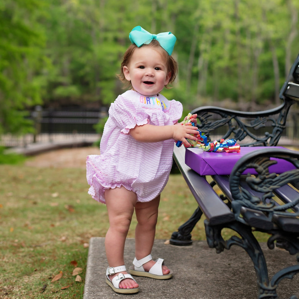 Smocked Birthday Girl Bubble for toddlers, perfect for celebrating special occasions in style.