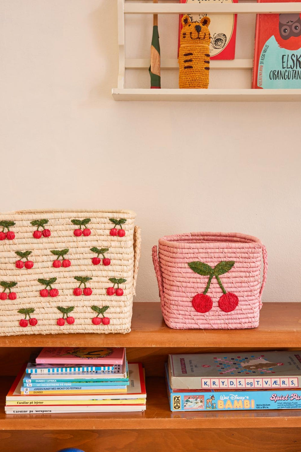 Pink Square Raffia Basket with Cherry Design for toys, perfect for organizing baby essentials.