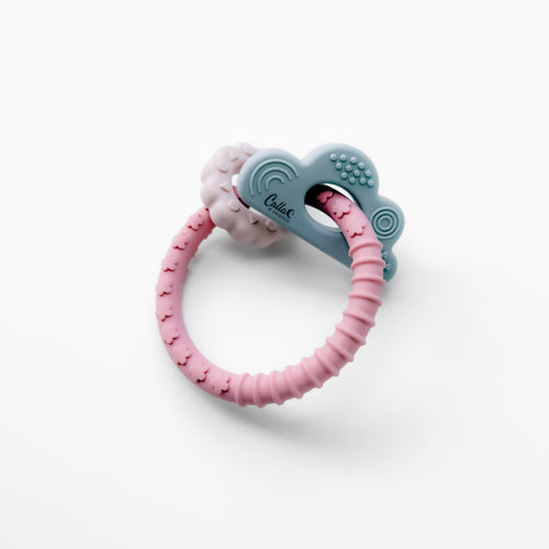 Cloudy Days Silicone Teether in soft gray, designed for soothing baby's gums, angled view showcasing its unique shape.