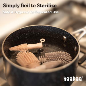 Haakaa Double-Ended Silicone Brush for easy bottle cleaning, shown from angle 6. Ideal for baby feeding accessories.