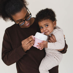 2 In 1 Snack Cups for babies, featuring a spill-proof design and easy-grip handles, perfect for on-the-go snacking.