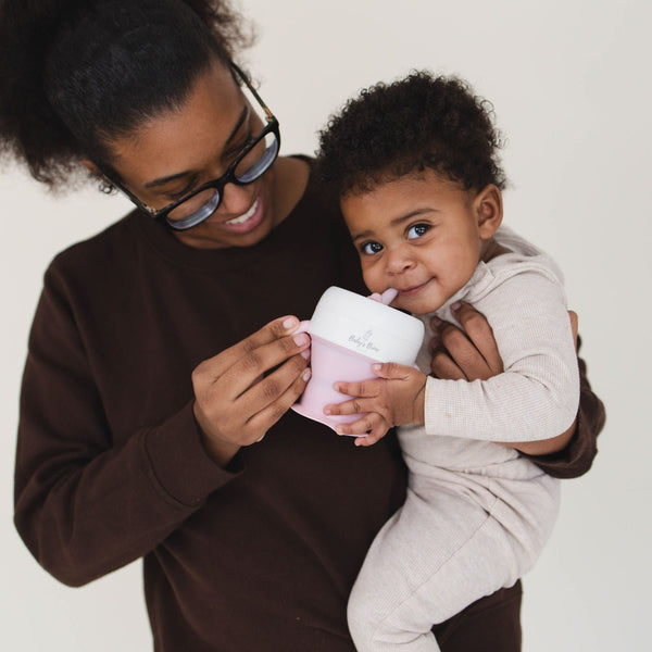 2 In 1 Snack Cups for babies, featuring a spill-proof design and easy-grip handles, perfect for on-the-go snacking.