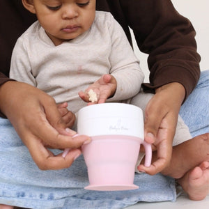 2 In 1 Snack Cups for babies, featuring a secure design and vibrant colors, shown from angle 4.