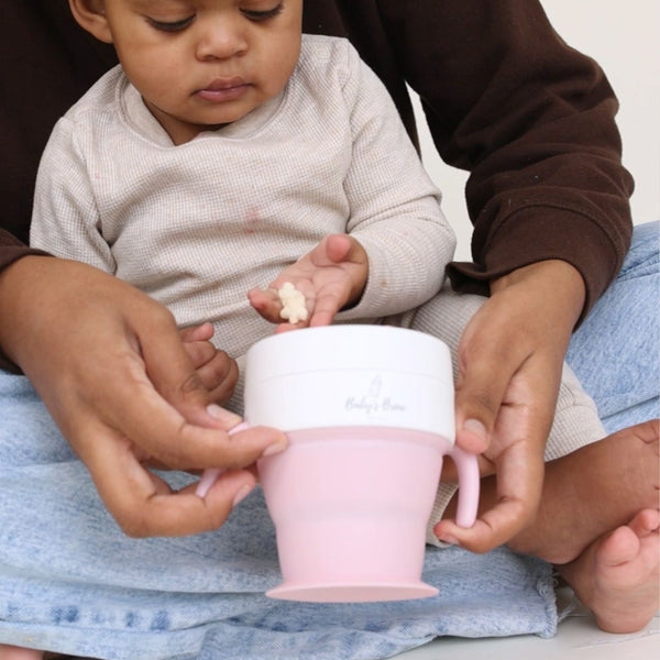 2 In 1 Snack Cups for babies, featuring a secure design and vibrant colors, shown from angle 4.
