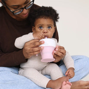 "2 In 1 Snack Cups for babies, angled view showcasing versatile design and easy grip for little hands."