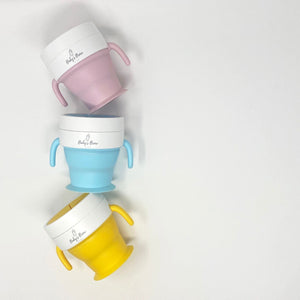 2 In 1 Snack Cups for babies, featuring a convenient design and vibrant colors, perfect for on-the-go snacking.