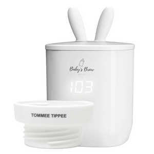 Portable bottle warmer with one adapter, angled view showcasing its compact design and functionality for on-the-go parents.