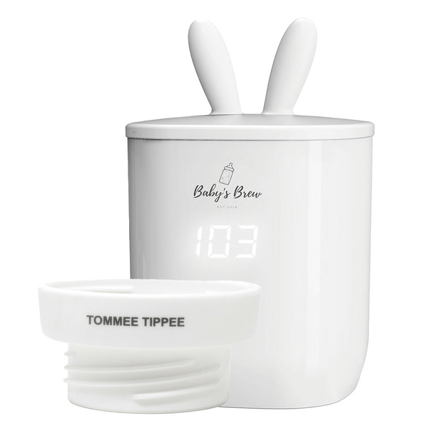 Portable bottle warmer with one adapter, angled view showcasing its compact design and functionality for on-the-go parents.