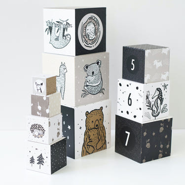 Nesting blocks featuring adorable baby animals, perfect for playful learning and development in infants.