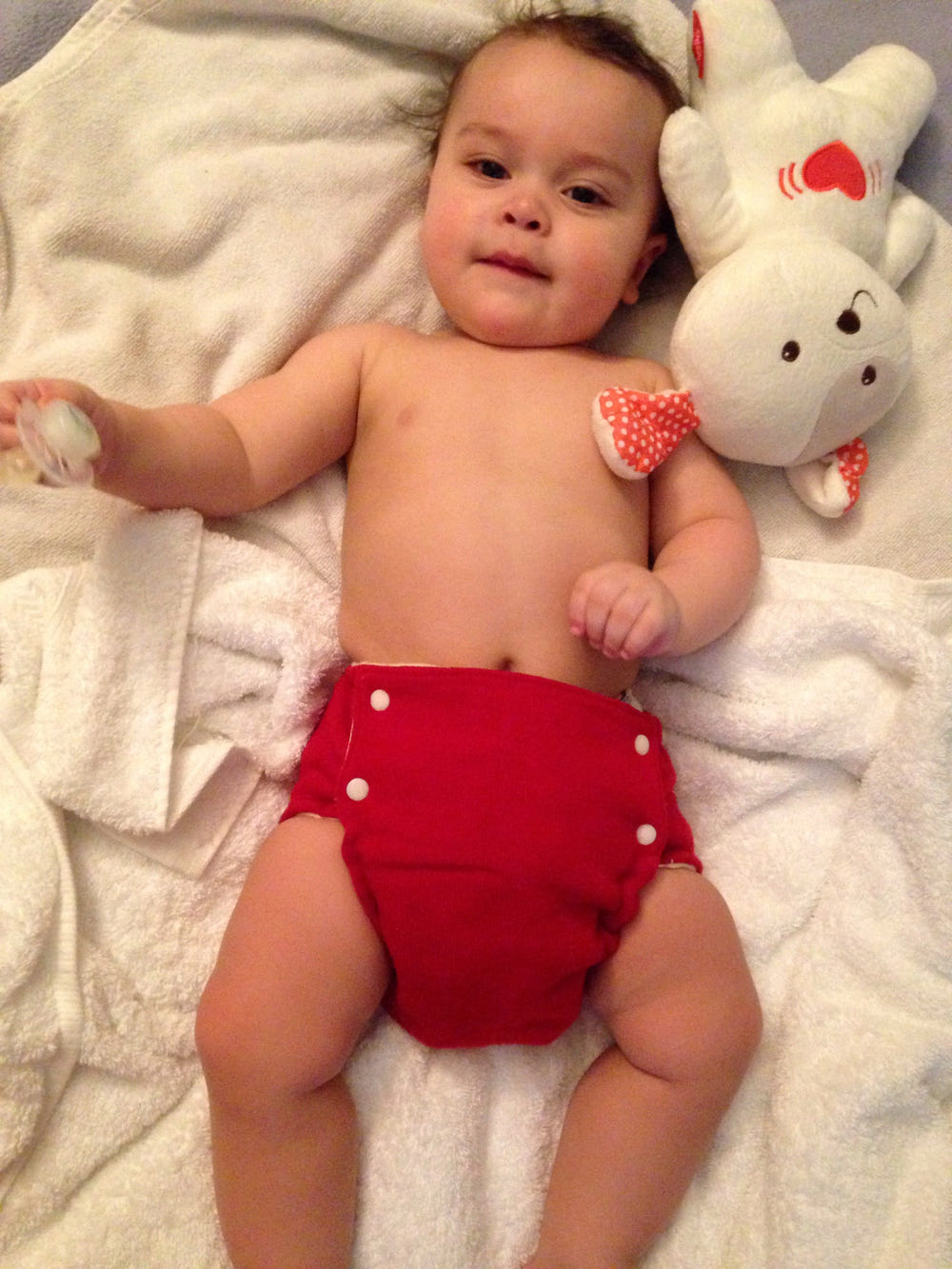 Solid color wool diaper cover for babies, soft and breathable, perfect for eco-friendly diapering solutions.