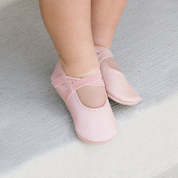 Blush ballet slipper baby shoe at angle 4, perfect for tiny dancers and stylish infants.