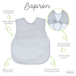 Solid light gray minimalist bapron for babies, angled view showcasing its stylish and functional design.