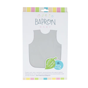 Solid light gray minimalist bapron for babies, angled view showcasing its stylish and functional design.
