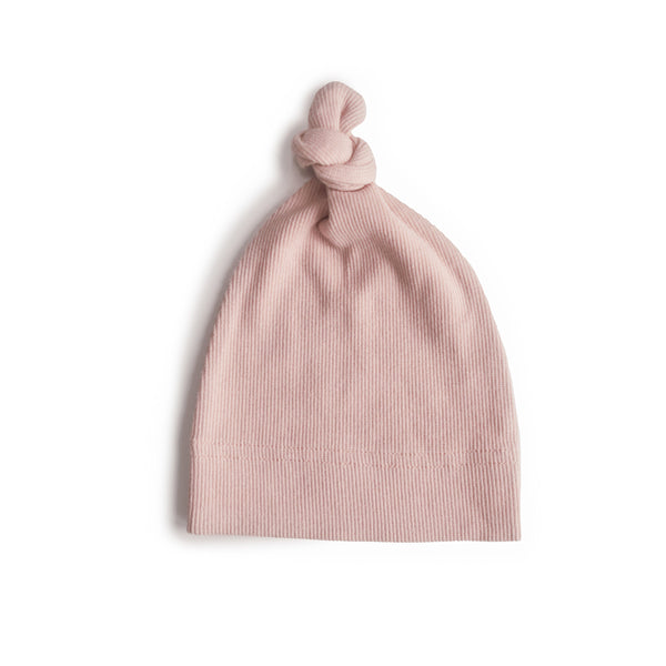 Ribbed baby beanie in soft fabric, angled view showcasing cozy design and stylish look for infants.