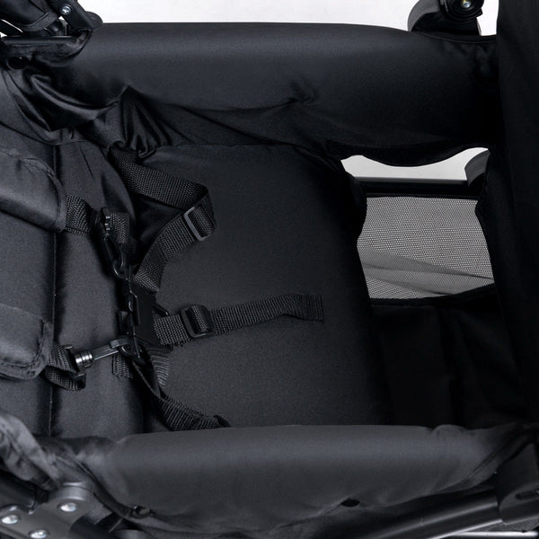 Foldable lightweight double baby stroller with front and back seats, angled view showcasing its compact design.